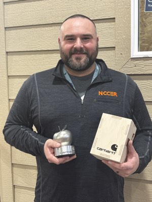 Aaron Haselwood with NCCER pullover and Carhartt award