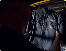 Carhartt work shirt on a hanger
