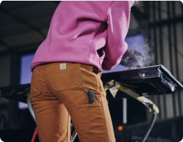 Welder in Carhartt pants